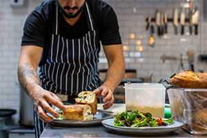 Chef plating seasonal ingredients
